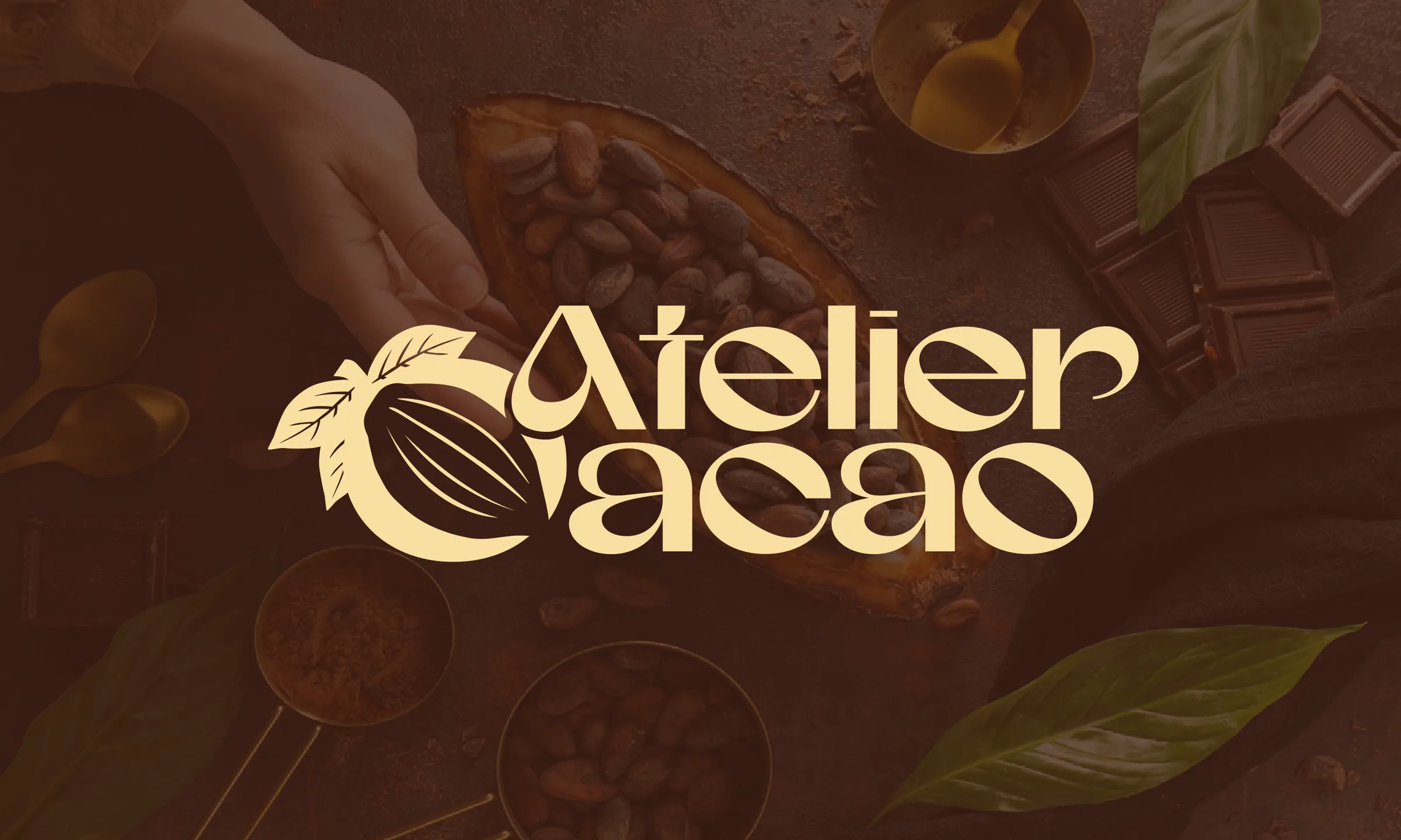 Atelier Cacao logotype over cacao beans