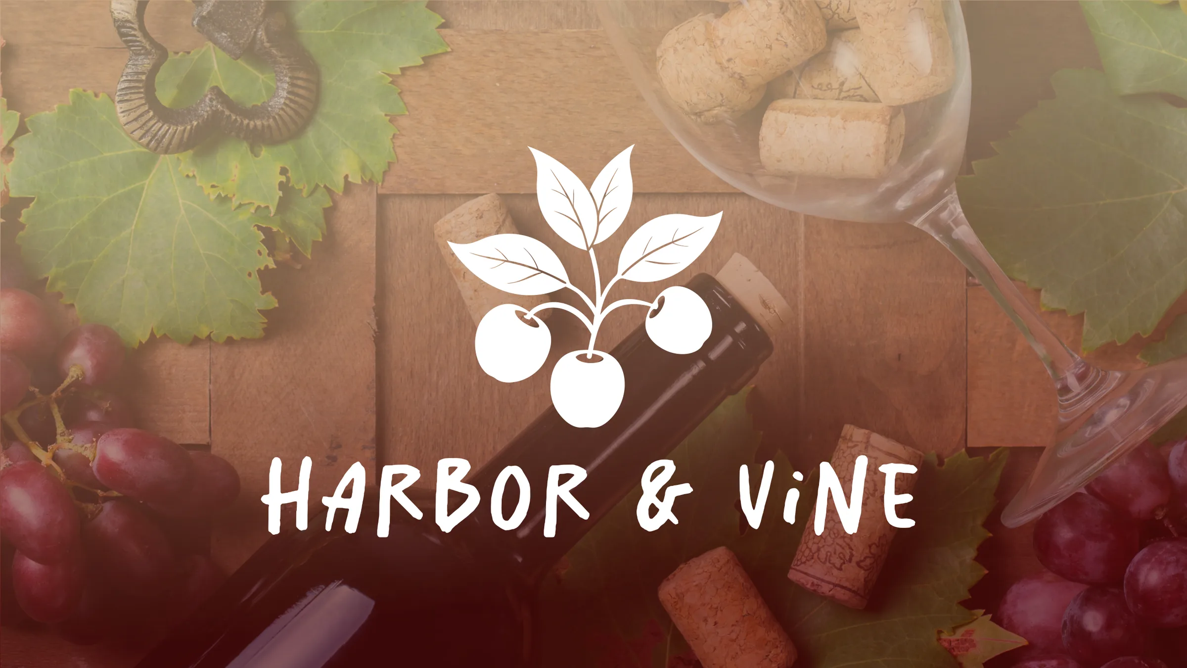 Harbor & Vine logo over grapes and wine